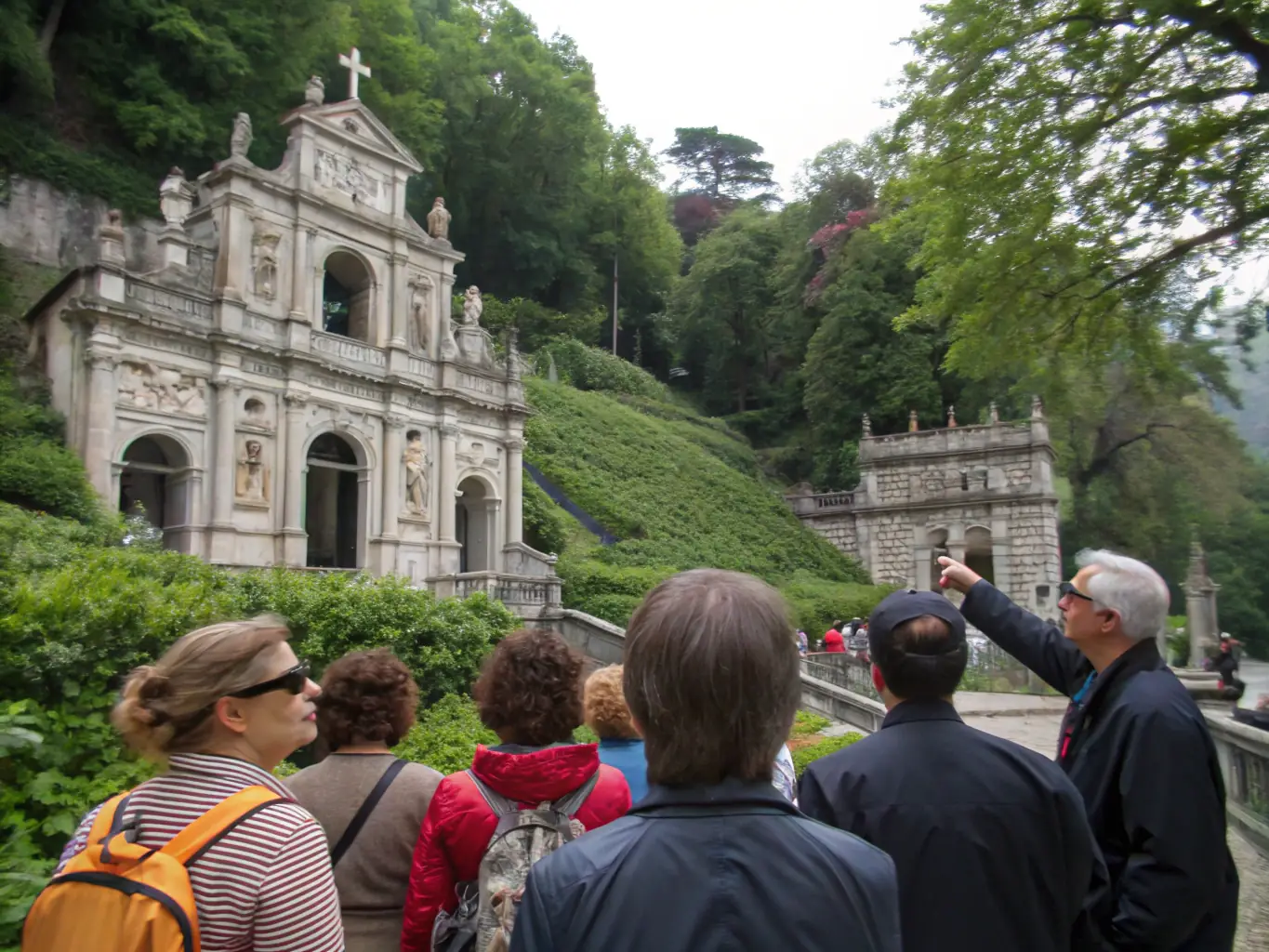 A scenic image of a guided heritage tour, showcasing historical landmarks and cultural sites, with participants actively listening to the tour guide.